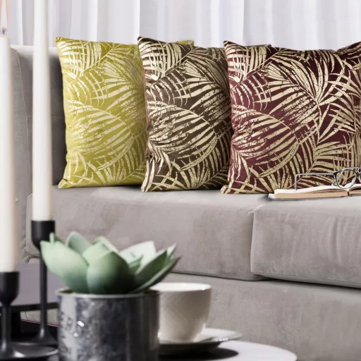 Stílusos trópusi levélmintás díszpárna huzat türkiz lila, arany színekkel, párnabelsővel. Modern,elegáns, art-deco enteriőrök tökéletes kiegészítője.l.  45x45cm