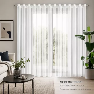  Modern fehér voile készfüggöny fém karikás kivitelben, rúdkarnisra. Könnyed, áttetsző enyhén fényes anyaga kellemes természetes fényt enged a helyiségbe, miközben elegáns megjelenést biztosít, 350X250