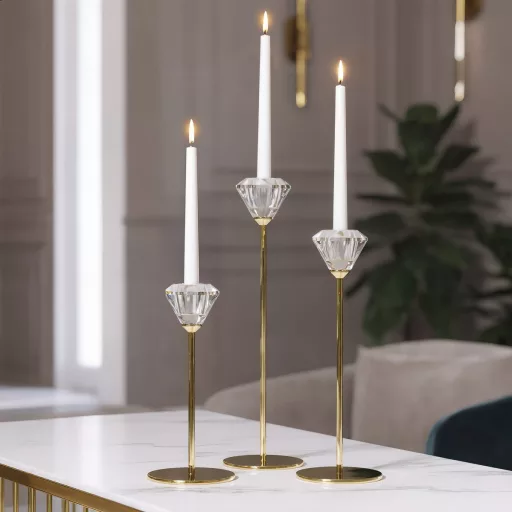 Elegáns arany színű  ,csiszolt áttetsző  üveg gyertyatartó 8X19cm